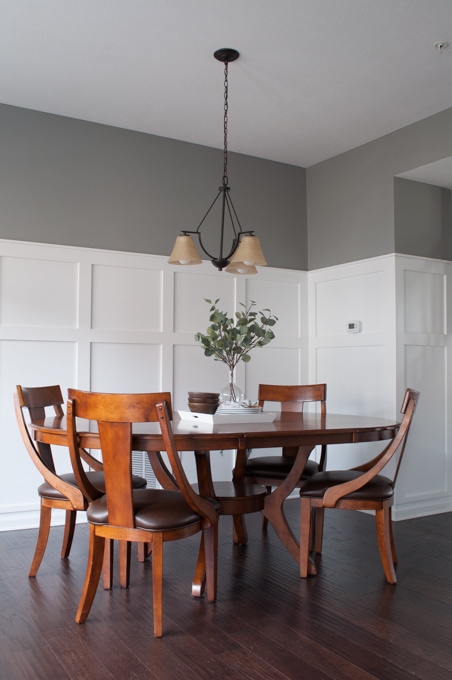 How to define a space with board and batten. A full tutorial for a budget friendly board and batten wall. This completely transformed the look of this dining room.