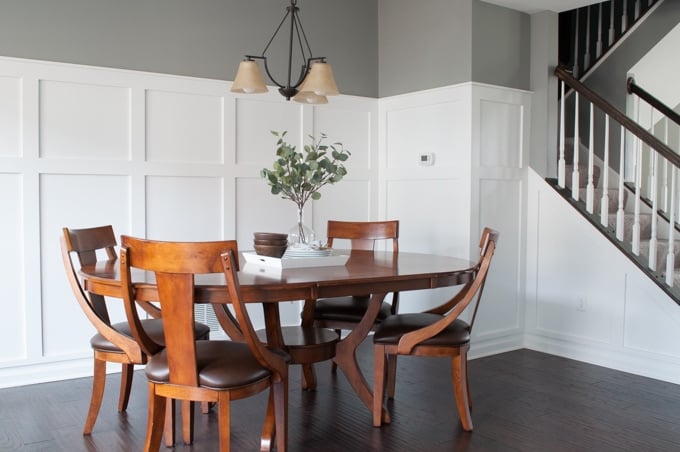 How to define a space with board and batten. A full tutorial for a budget friendly board and batten wall. This completely transformed the look of this dining room.