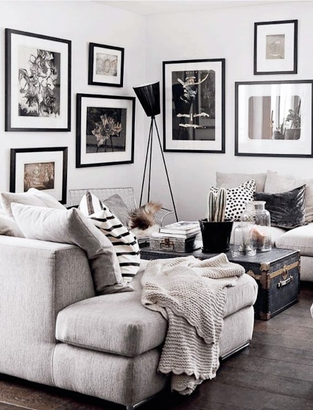 living room with black and white gallery wall