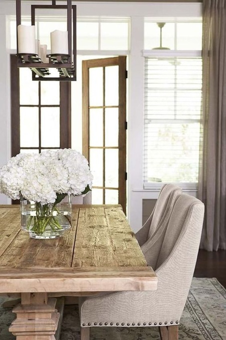 dining room with wooden table and upholstered chairs