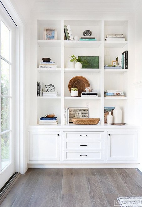 bright white built in bookshelves and home decor styling shelves