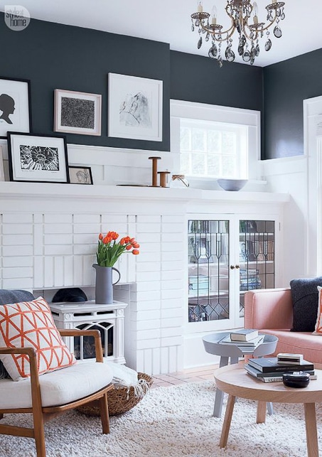 modern and bright white and gray living room with orange accents