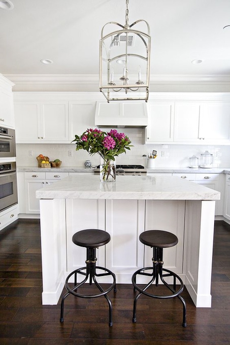 modern bright white kitchen with marble counters