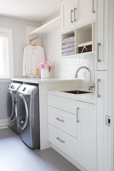 bright white laundry room with clean lines and modern design