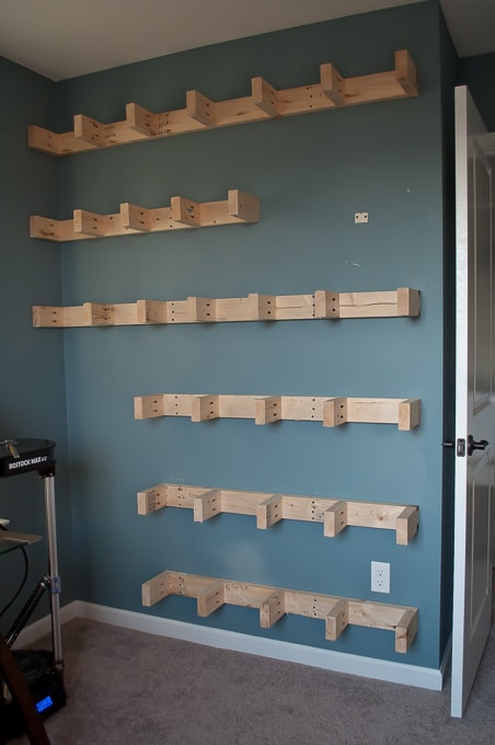 Step by step tutorial for building amazing floating shelves for an industrial masculine office. These only cost her $150 to build!