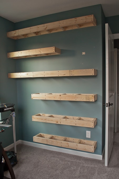 Step by step tutorial for building amazing floating shelves for an industrial masculine office. These only cost her $150 to build!