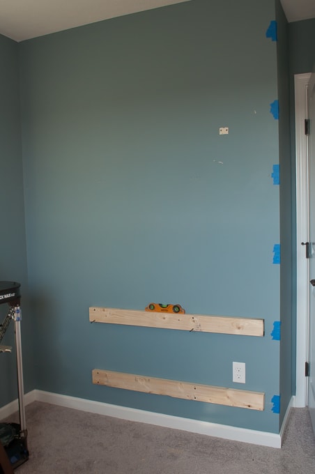 Step by step tutorial for building amazing floating shelves for an industrial masculine office. These only cost her $150 to build!