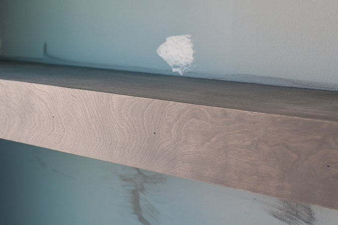 Step by step tutorial for building amazing floating shelves for an industrial masculine office. These only cost her $150 to build!