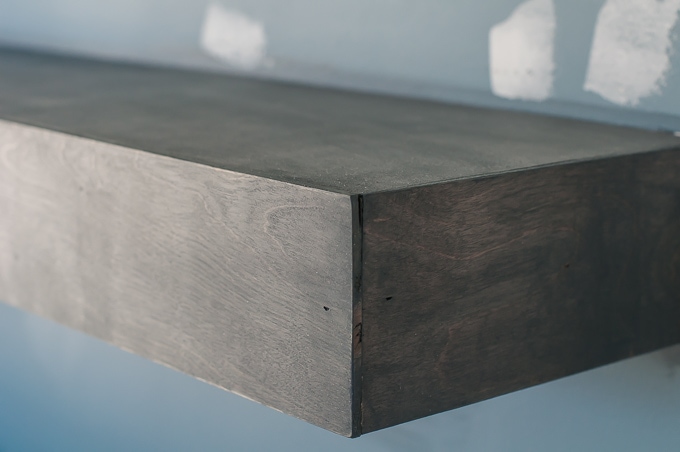 Step by step tutorial for building amazing floating shelves for an industrial masculine office. These only cost her $150 to build!