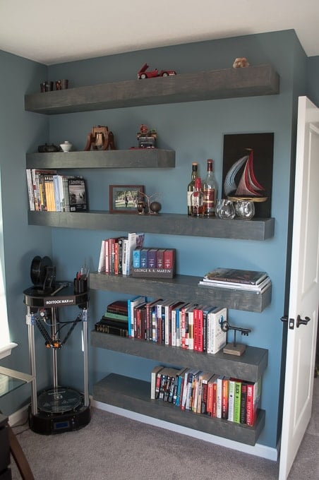 Step by step tutorial for building amazing floating shelves for an industrial masculine office. These only cost her $150 to build!