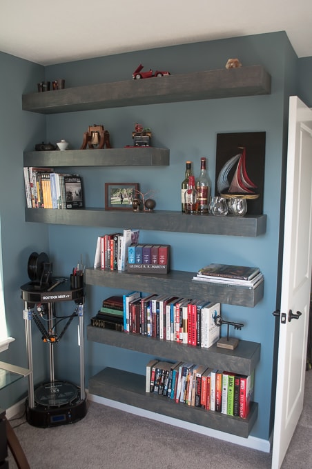Step by step tutorial for building amazing floating shelves for an industrial masculine office. These only cost her $150 to build!