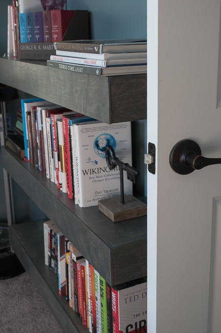 Step by step tutorial for building amazing floating shelves for an industrial masculine office. These only cost her $150 to build!