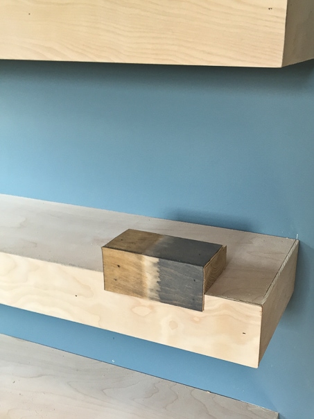 Step by step tutorial for building amazing floating shelves for an industrial masculine office. These only cost her $150 to build!
