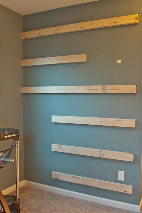 Step by step tutorial for building amazing floating shelves for an industrial masculine office. These only cost her $150 to build!