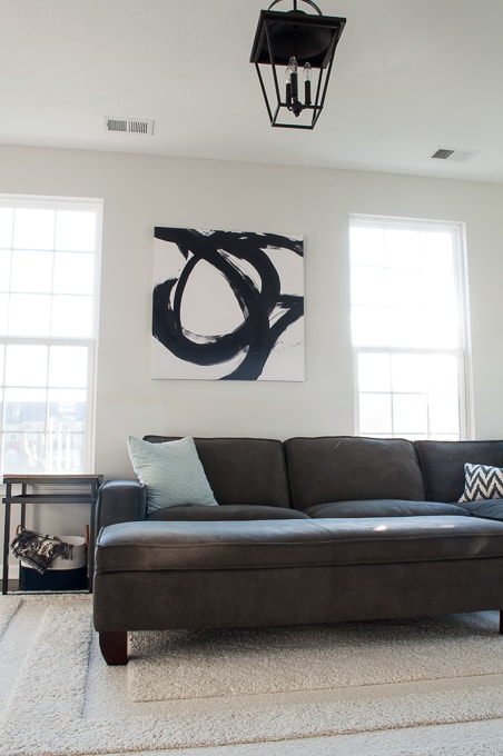 I love this modern black and white abstract art in the living room! Bold and beautiful!