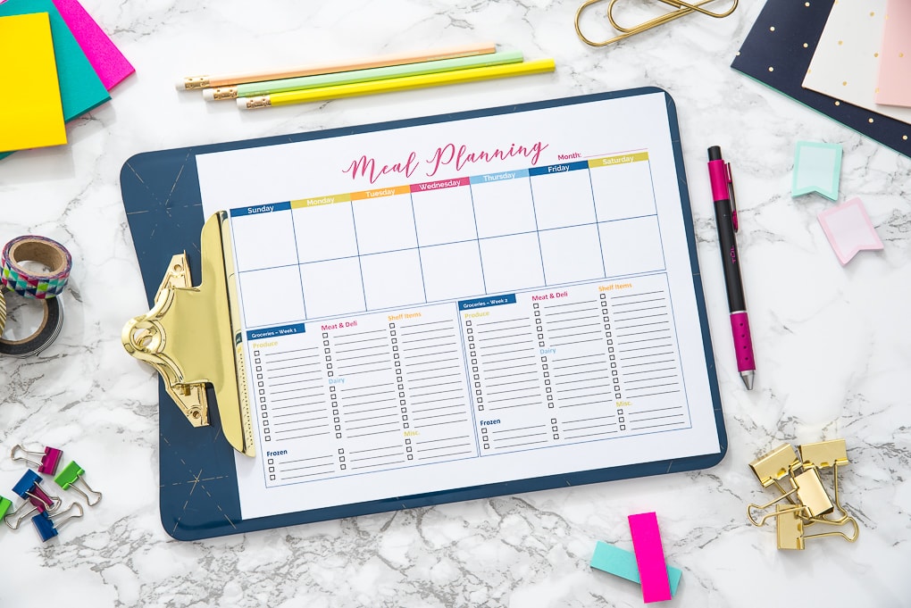 blank meal planning printable on a desk with accessories