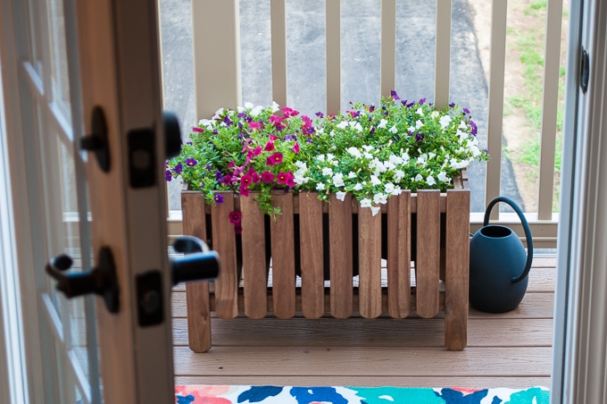 Look at how she decorates this small space townhome porch! Perfect for summer! I love all the bright colors