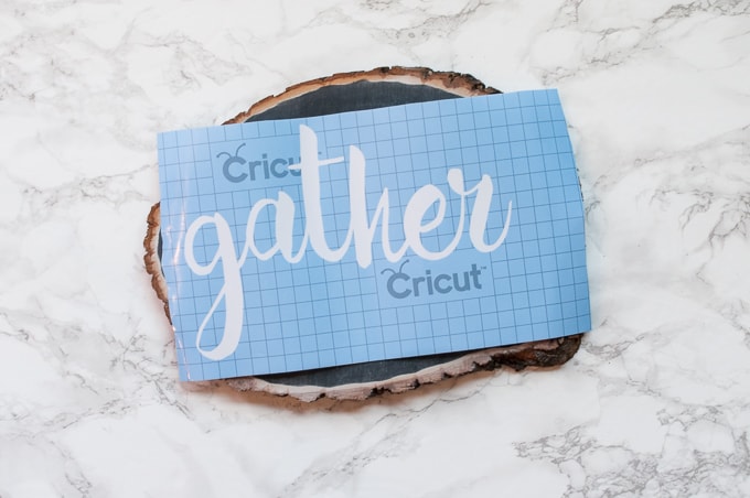 DIY tutorial for this pretty gather chalkboard wood slice sign. Easy way to create hand-lettered chalk designs.