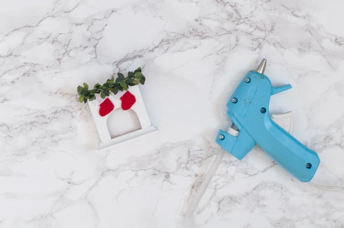 Look at this super cute mini Christmas fireplace ornament! I love how adorable it is - it's even got a tiny plate of cookies! Can't wait to make this for my tree!
