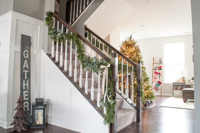 Modern meets Traditional Christmas Home Tour. This pretty white kitchen looks like a whimsical Christmas bakery. Check out the beautiful all white gingerbread house!