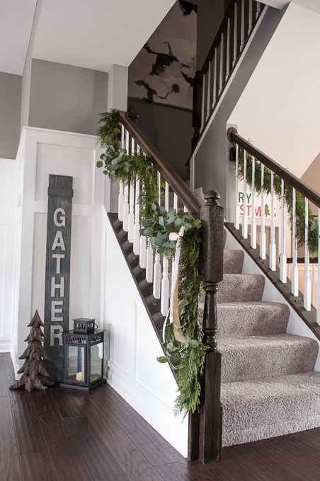 Create this beautiful pine and eucalyptus Christmas garland for your home. It looks so realistic but it's actually fake! I love the mixed green look.