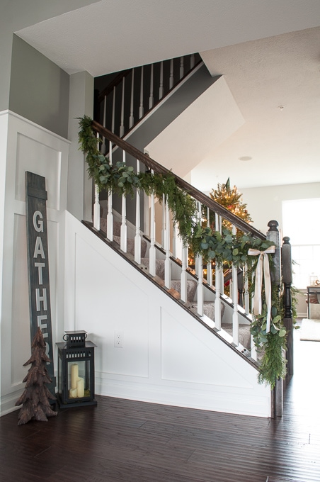 Create this beautiful pine and eucalyptus Christmas garland for your home. It looks so realistic but it's actually fake! I love the mixed green look.