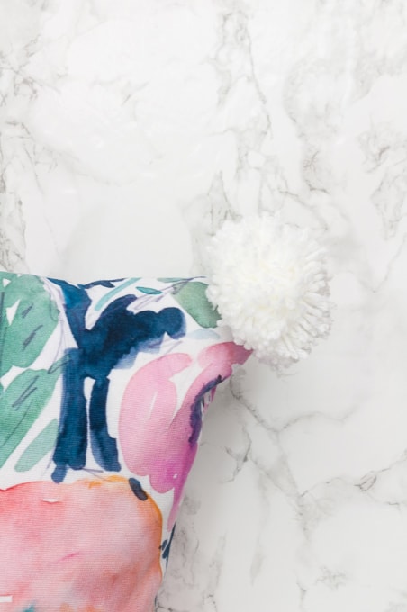 Make the perfect pom poms using this easy to use tool! I love pom poms in modern home decor. They are so trendy right now and super playful!