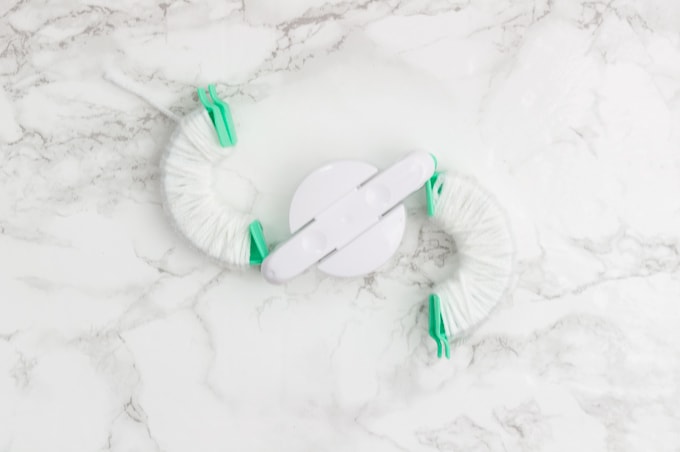 Make the perfect pom poms using this easy to use tool! I love pom poms in modern home decor. They are so trendy right now and super playful!