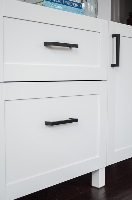 How to choose modern hardware for a media center. Get a built-in look on a budget using IKEA BESTA cabinets and affordable hardware from Amazon.