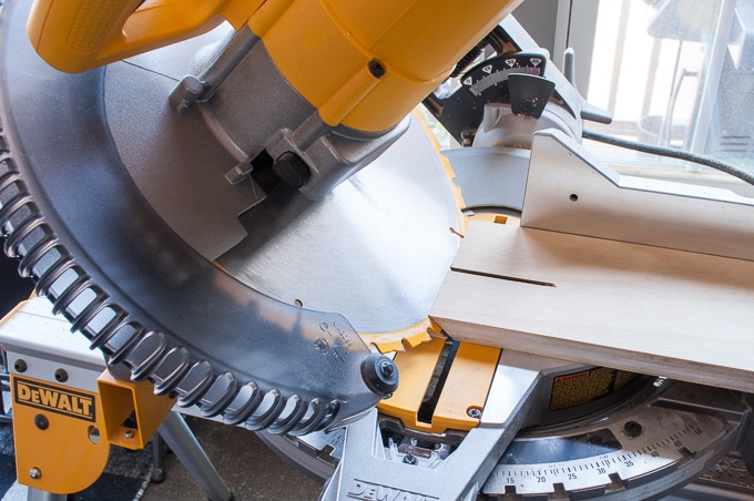 miter saw cutting plywood