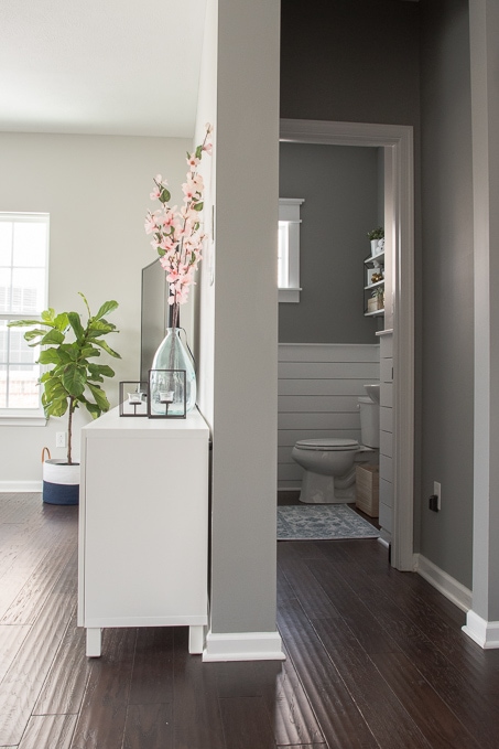 Check out this beautiful powder room reveal! This tiny bathroom was transformed from boring to fresh and modern! I love the shiplap and the modern classic decorations.