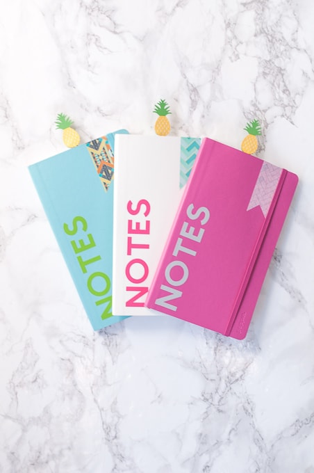 How to make custom notebooks using the Cricut Explore. Learn how to use Cricut Design Space to make these fun notebooks with vinyl, washi, and cardstock!