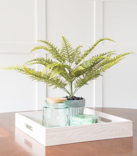 Create a beautiful DIY faux fern arrangement using supplies from your local craft store. See the full tutorial for this easy home decor project.
