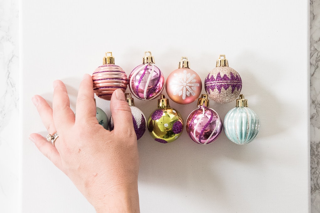 DIY Christmas Tree Ornament Art. Create a bright and modern art piece using Christmas ornaments. See other DIY home decor ideas in the Handmade Holidays Blog Hop!