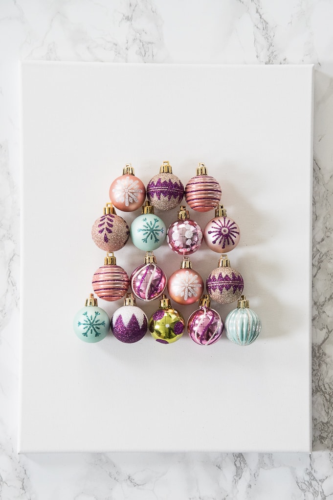 DIY Christmas Tree Ornament Art. Create a bright and modern art piece using Christmas ornaments. See other DIY home decor ideas in the Handmade Holidays Blog Hop!