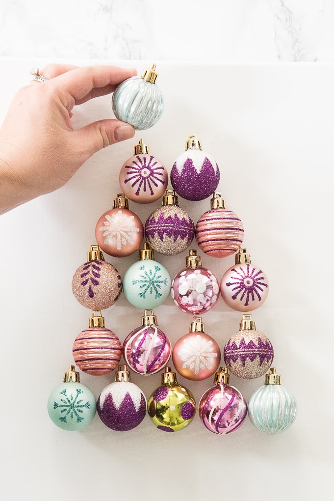 DIY Christmas Tree Ornament Art. Create a bright and modern art piece using Christmas ornaments. See other DIY home decor ideas in the Handmade Holidays Blog Hop!