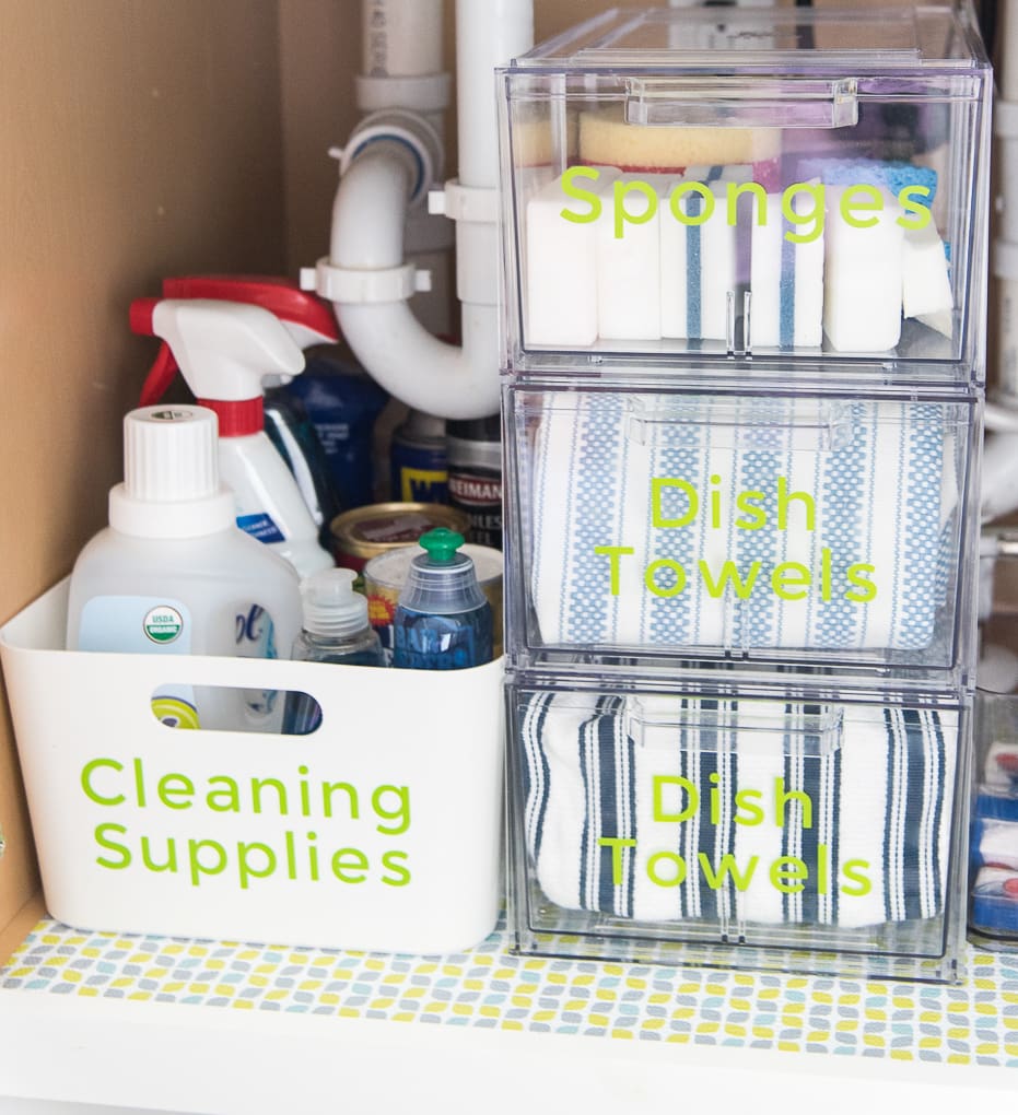 How to organize under the kitchen sink. Get rid of all the clutter and create a functional and beautiful organized cabinet. Learn exactly what organizing products to buy. 