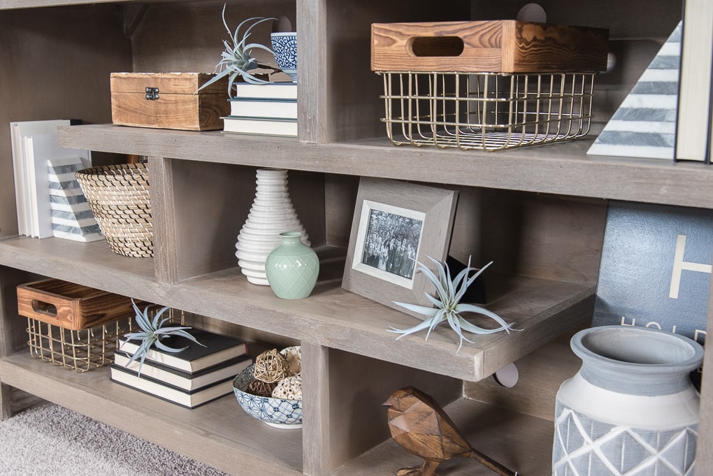 How to style bookshelves. Tips, tricks, and ideas for decorating shelves and bookcases with more than just books. Make your shelves look intentionally decorated and put together.