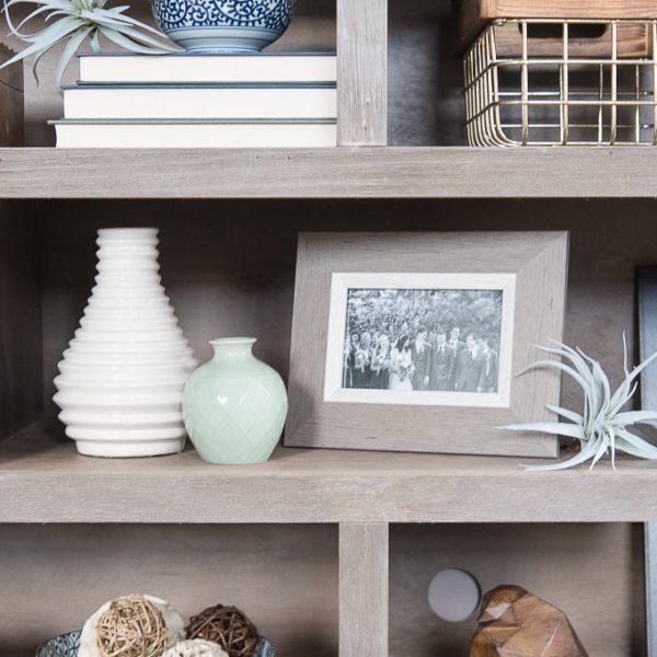 How to style bookshelves. Tips, tricks, and ideas for decorating shelves and bookcases with more than just books. Make your shelves look intentionally decorated and put together.