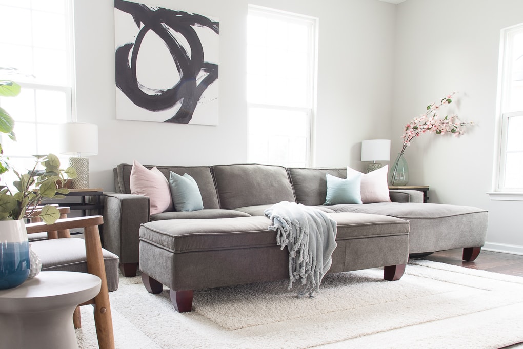 Come take a tour of our home decorated for spring! I’m excited to share a simple and bright spring living room tour. Pastel colors and natural elements make this room feel fresh for spring.