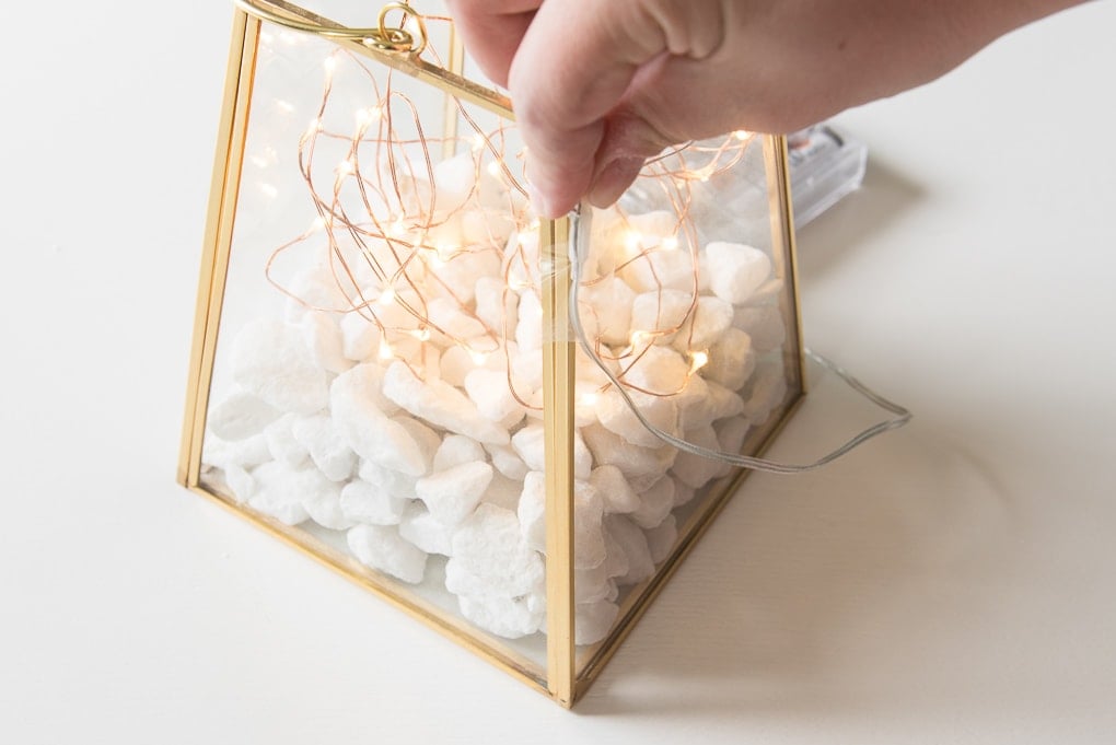 gold terrarium with fairy lights wire wrapping