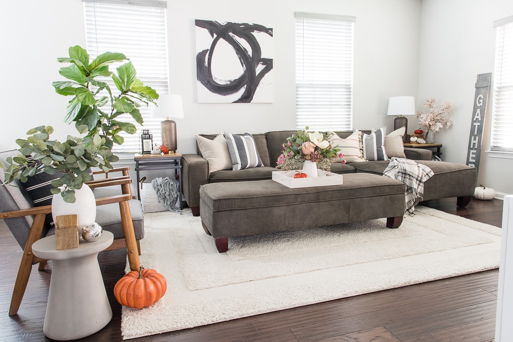 fall living room with orange pumpkin and faux florals