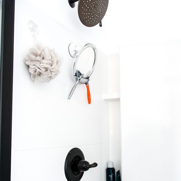 Moen Velocity Shower Head installed in a white shower in a master bathroom