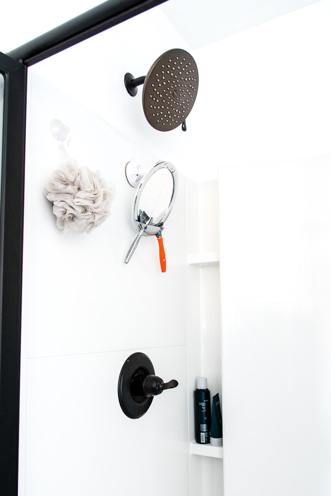 Moen Velocity Shower Head installed in a white shower in a master bathroom