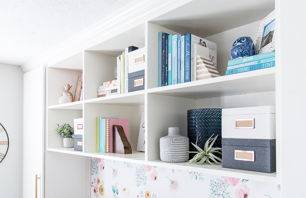 styled bookshelves with colorful accent pieces