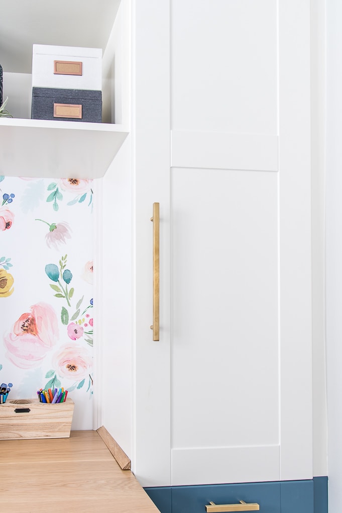 white cabinet door with gold hardware