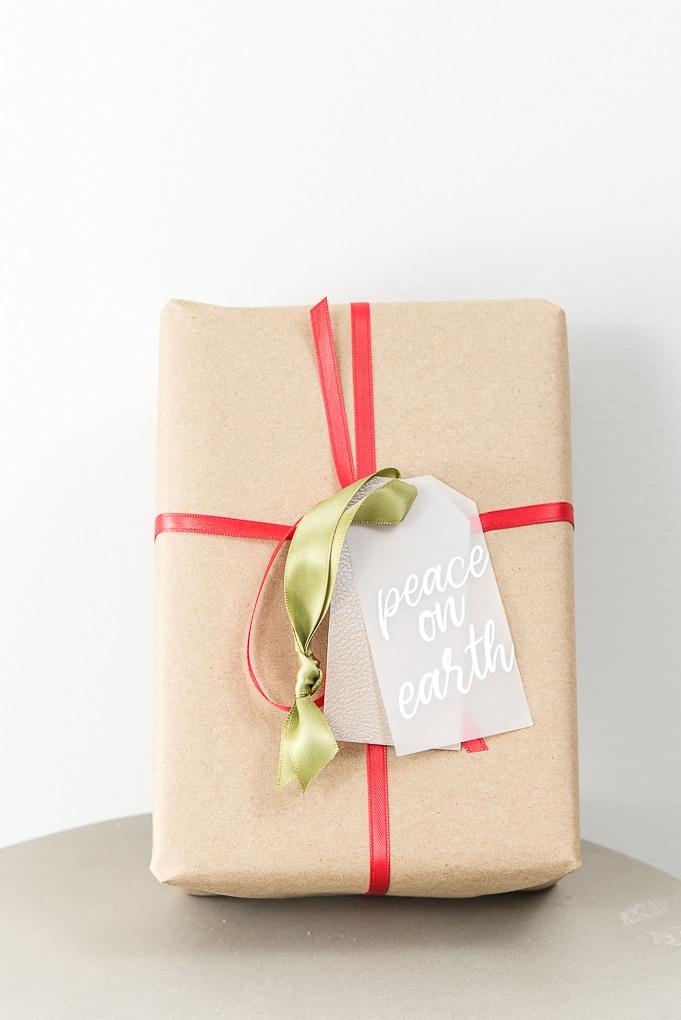peace on earth layered gift tag on brown Christmas gift box