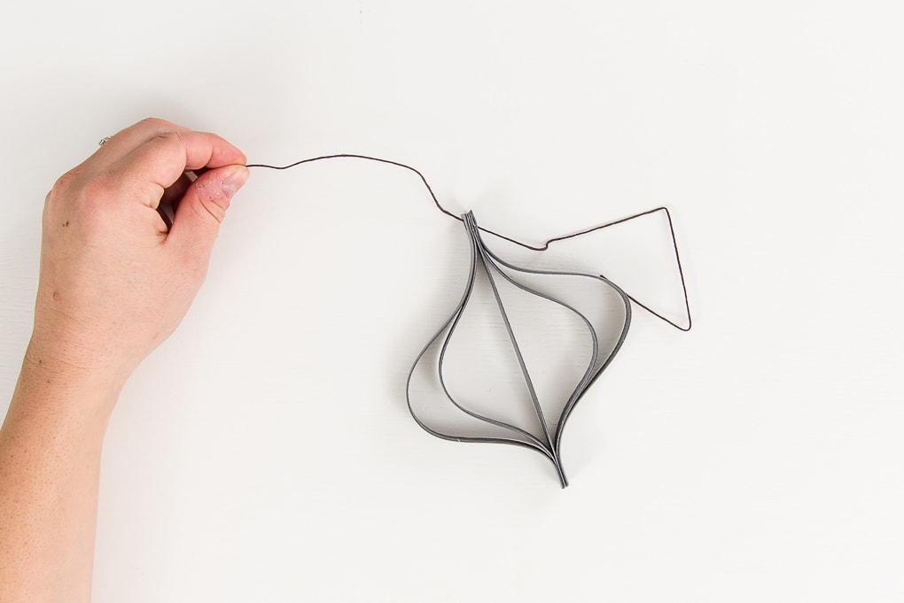 adding string to a gray modern leather Christmas ornament