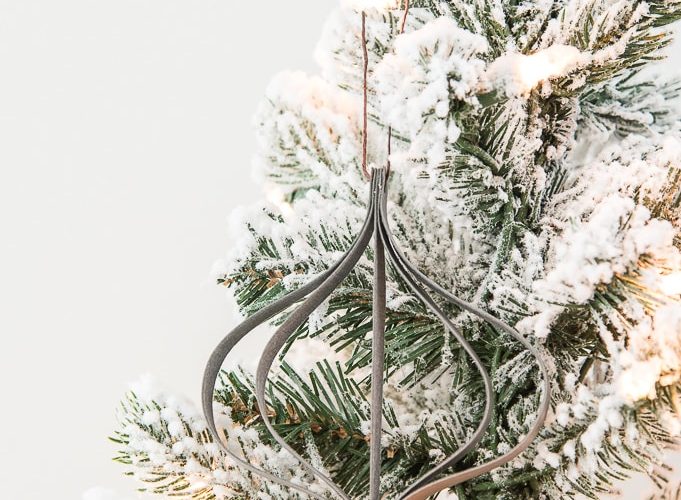 gray modern leather ornament on a flocked Christmas tree