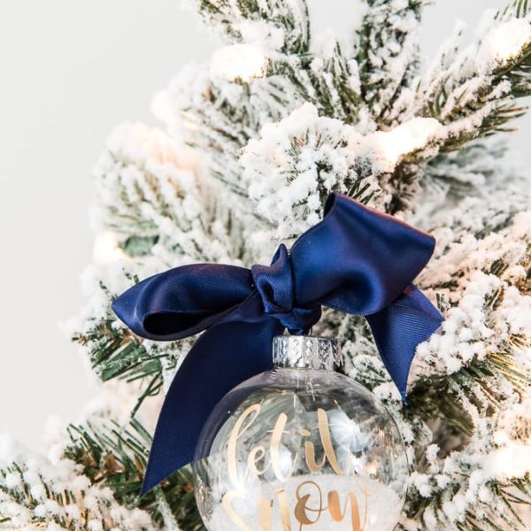 let it snow clear Christmas ornament with white glitter and navy ribbon